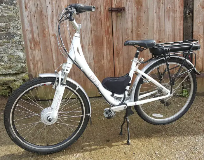 Front wheel electric bike conversion kit fitted to a ladies hybrid bike