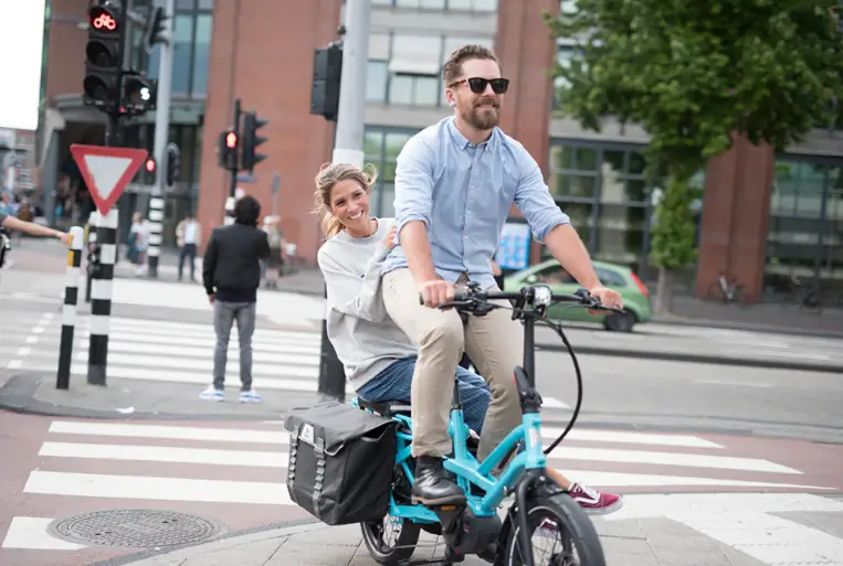 the tern gsd s10 cargo bike carrying an adult passenger