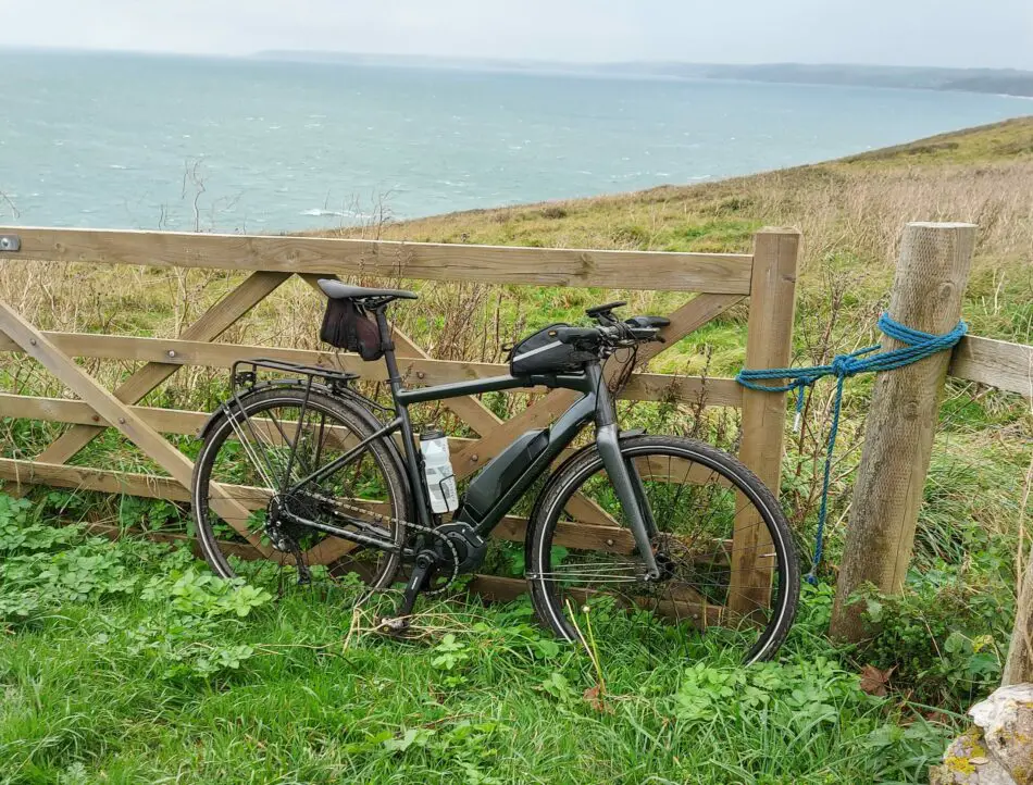 vitus mach e pictured by a gate overlooking the sea